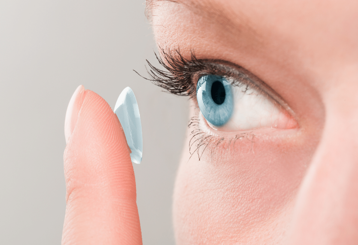 girl inserting a contact lens